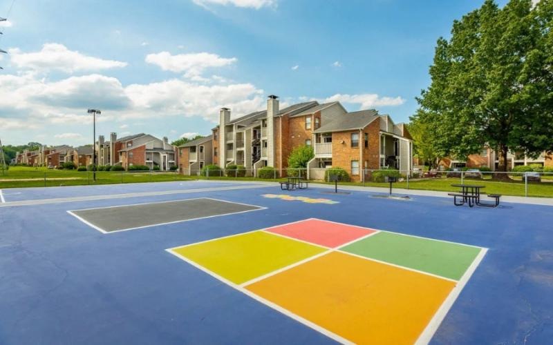 a basketball court in front of a building