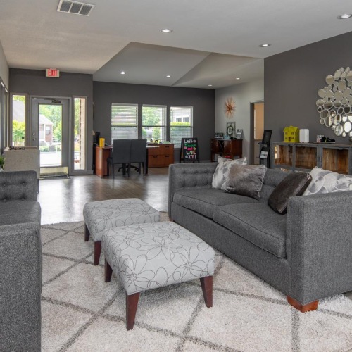 a living room with a couch and a chair