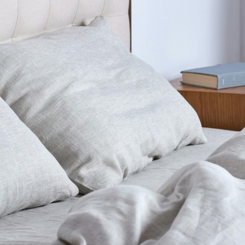a bed with a white comforter